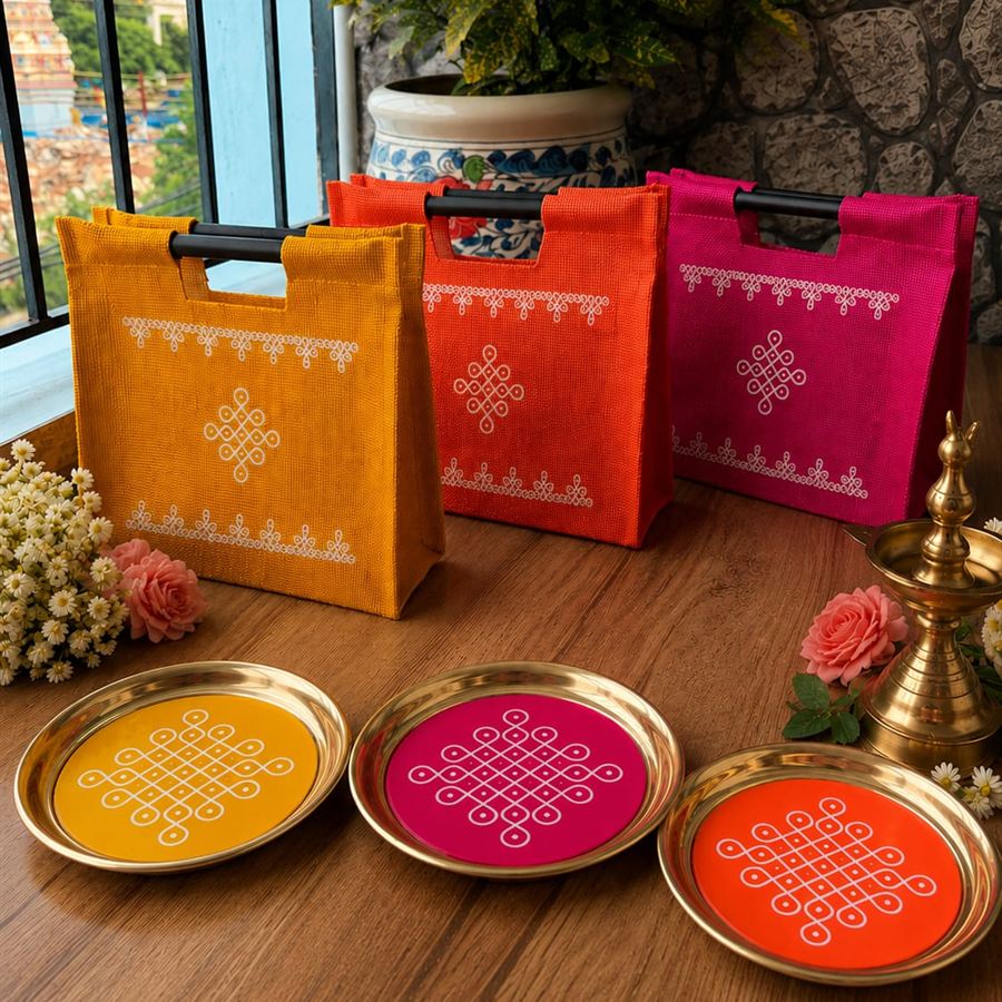 Yellow, orange and pink kolam jute bags with matching brass kolam plates